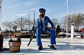 Wooden figure at orth harbor in Baltic coast, Fehmarn, Schleswig-Holstein, Germany