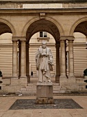 Statue in the courtyard of College de France in Paris, France