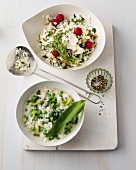 Risotto with goat cheese and wild garlic with rice stew in bowls