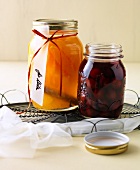 Cherry compote and orange punch in glass jar