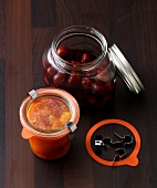 Cherry compote and mango chutney in glass container