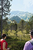 Tourists at Salwideli Moor and Alps in background, Lucerne, Entlebuch, Switzerland