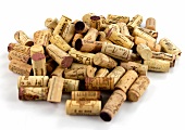 Several corks in pile on white background