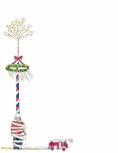 Illustration, Ein an den Maibaum gefesselter Feuerwehrmann