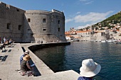 Tourists at fortress Sveti Ivan in Dubrovnik, Croatia