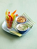 Vegetable sticks with two dips on plate