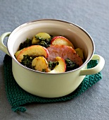 Kale stew with smoked pork in pan