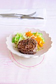Beef steaks with Chinese cabbage on plate, low GI diet food