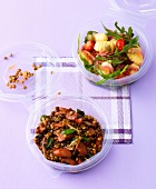 Gnocchi salad with salami and lentil debreziner salad in bowls