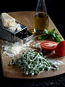 Ingredients for pasta on wooden board