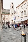 People near bell tower in old town, Dubrovnik, Croatia