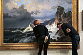 Two people looking into painting in Stadel Museum, Frankfurt, Hesse, Germany
