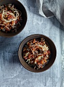 Noodles with ragu bolognese in bowls