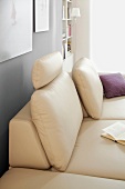 Close-up of beige leather sofa with backrest