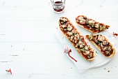 Baguette with mushrooms on white background