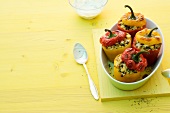 Peppers filled with chilli couscous in serving dish