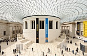 People in courtyard of British museum with glass roof on Great Russell street, London, UK
