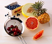 Various low sugar fruits on white background