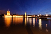 View of Houses of Parliament at Westminster, Big Ben and river Thames at dusk, London, UK