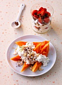 Strawberry curd in glass, papaya with cheese cream on plate