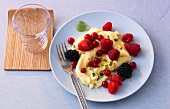 Vanilla scrambled eggs with berries on plate