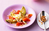 Avocado and grapefruit salad on plate