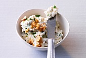 Feta spread in bowl with knife