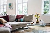 Living room with sofa, cushions and coffee table