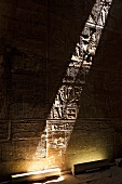 Beam of sunlight falling on wall with reliefs at Temple of Edfu, Egypt