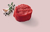 Raw steak with herbs and spices