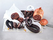 Different varieties of blood sausage on tissue paper