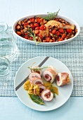 Chicken roulade with figs with chicken legs in serving dish