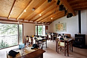 Tables laid in dining room of Grotto Sassalto Restaurant, Caslano, Switzerland