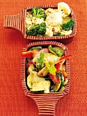 Herbal vegetables with sprouts and cheese sauce on serving tray