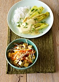 Bowl of chicory in mustard sauce and tofu and rice skillet on plate 