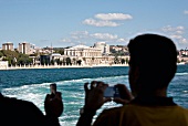 Tourists photographing Dolmabahce Palace in Istanbul
