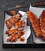 Close-up of ribs with spicy honey sauce in baking dish