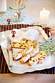 Sliced quark stollen with icing sugar on serving tray
