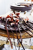 Roasted bacon dates skewered on sticks