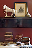 Books, horse sculpture and photo frame in Atelier at Leighton House Museum, London, UK