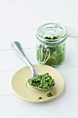 Pesto in a jar and on a spoon