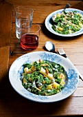 Pasta with kale, nuts and gorgonzola cheese on plate