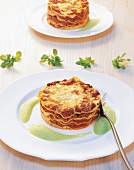 Lasagne with basil foam on plates
