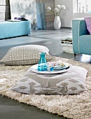 Linen floor cushion with handle on beige carpet