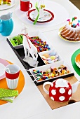 Bowl of candy on colorfully decorated dining table