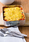 Potato and vegetable lasagne in baking dish