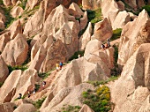 Elevated view of people trekking at Goreme Anatolian from Hill Aktepe, Cappadocia, Turkey