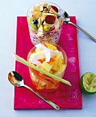 Lime fruit salad and vanilla yogurt fruit salad in glasses