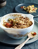 Vegetable crumble with parmesan in bowl