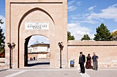 People standing at Muzesi Veli Dervish Monastery Gate, Cappadocia, Anatolia, Turkey